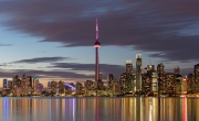 TORONTO, CANADA - NOVEMBER 02, 2015: View of Downtown Toronto skyline with the CN Tower and financial district skyscrapers illuminated after sunset.